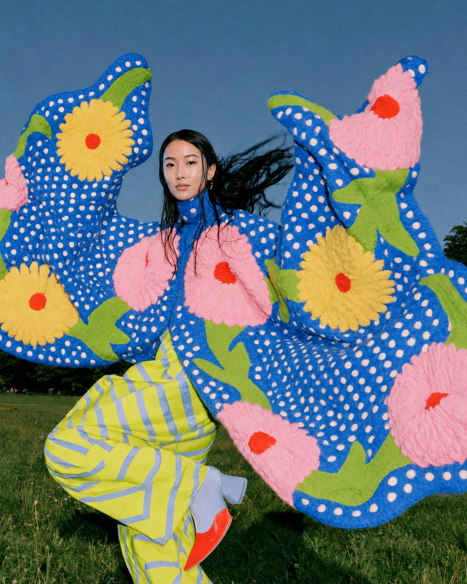 Blue polka-dot floral knit look, dancing in a field