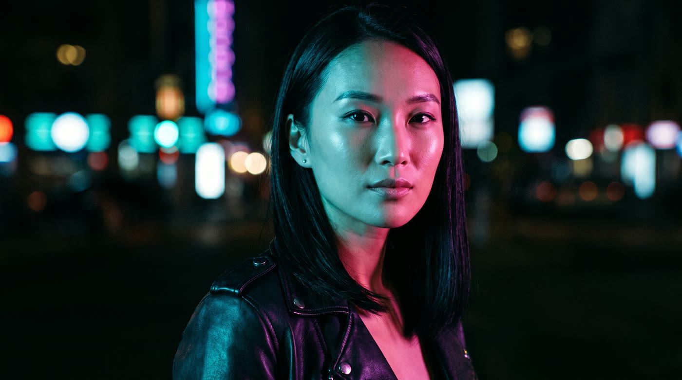 Neon-lit night portrait in cyan and magenta