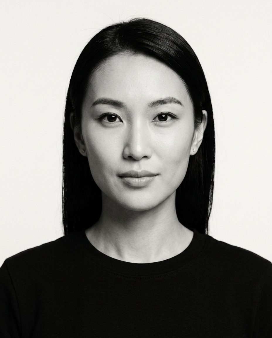Black-and-white identity portrait, direct calm gaze